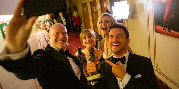 Chris Hooper, Patti LuPone, Marianne Elliott and Jonathon Bailey take a selfie with their awards for 'Company'. Photo by David Levene.
