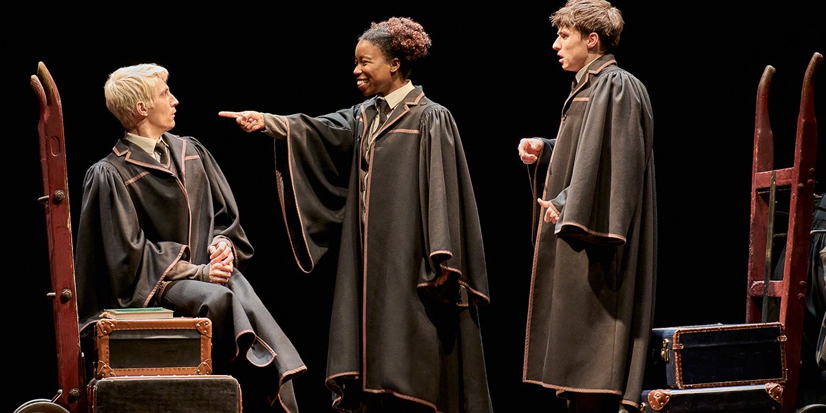 Luke Sumner as Scorpius Malfoy, Phoenix Edwards as Rose Granger-Weasley, and Dominic Short as Albus Potter on stage.