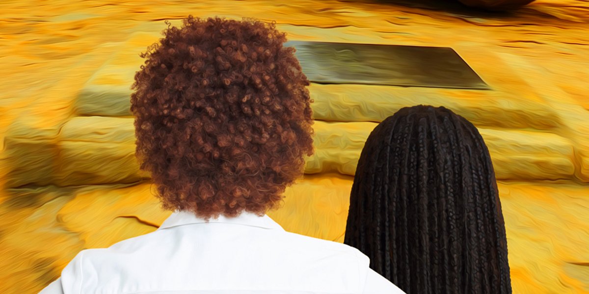 Two people stand, side by side, with their backs towards the camera