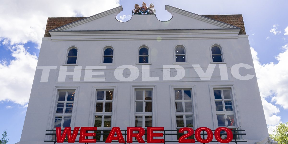 The Old Vic theatre's white facade with large red 'WE ARE 200' sign.