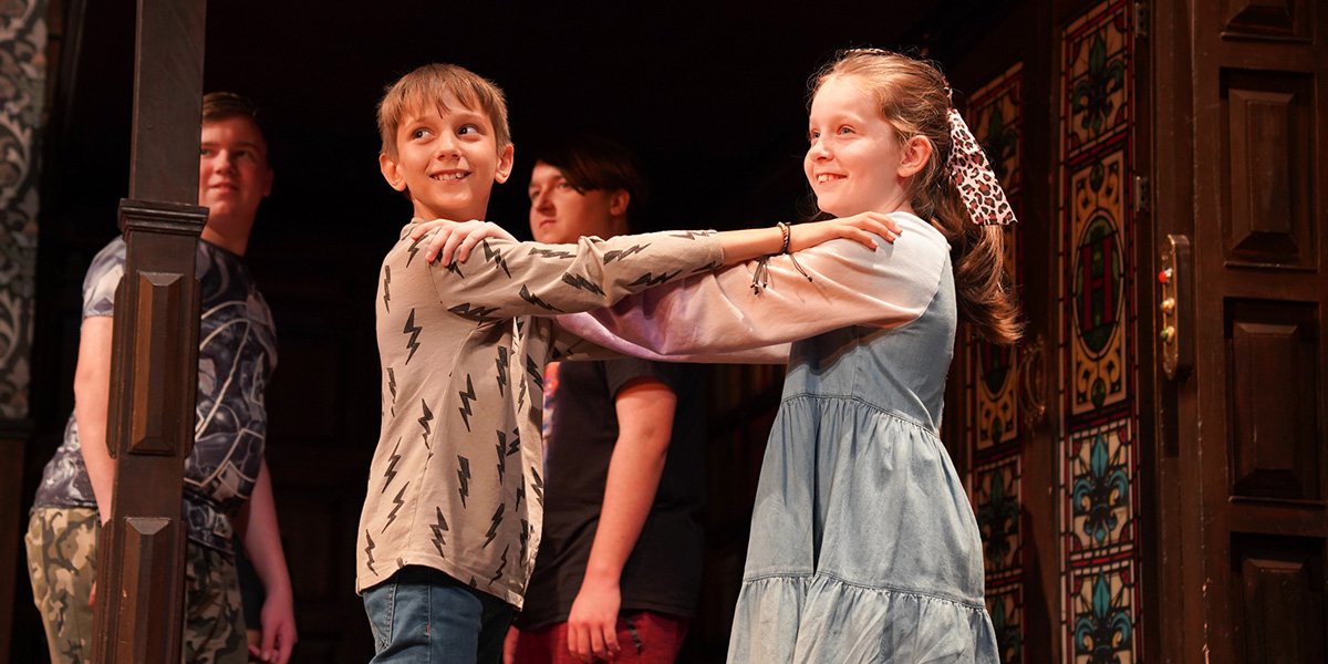 Children enjoying the Kids Week stage combat workshop at The Play That Goes Wrong