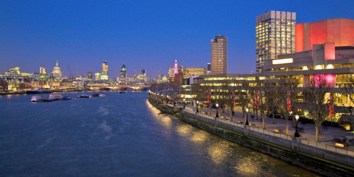 A stage at the National Theatre showcasing a sound design award ceremony with audience members in attendance.
