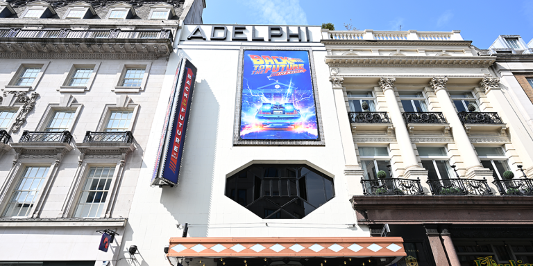 The Adelphi Theatre exterior features a red brick facade with a marquee displaying "Back to the Future.